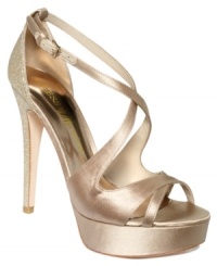 Award-winning style is nearly yours. GUESS by Marciano's Karisma platform evening sandals are perfectly shiny with a glitter covered heel that will make your night really sparkle. Award-winning style is nearly yours. GUESS by Marciano's Karisma platform evening sandals are perfectly shiny with a glitter covered heel that will make your night really sparkle.