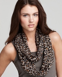 A lightweight loop scarf in a dark tan animal print, a fierce style from Fraas. A lightweight loop scarf in a dark tan animal print, a fierce style from Fraas.