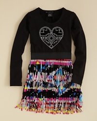 A tasseled native-print skirt and a rhinestone heart glyph blends old and new styles for a fresh look that feels thoroughly modern. A tasseled native-print skirt and a rhinestone heart glyph blends old and new styles for a fresh look that feels thoroughly modern.