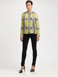 Shimmering silk blouse modernized by an abstract check print. CrewneckButton frontLong sleeves with buttoned cuffsWoven silkDry cleanImportedModel shown is 5'10 (177cm) wearing US size 2. Shimmering silk blouse modernized by an abstract check print. CrewneckButton frontLong sleeves with buttoned cuffsWoven silkDry cleanImportedModel shown is 5'10 (177cm) wearing US size 2.