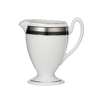 Intricately textured platinum rings on pure white china paired with the fashionably modern look of ebony creates a new sophistication for your table. Intricately textured platinum rings on pure white china paired with the fashionably modern look of ebony creates a new sophistication for your table.