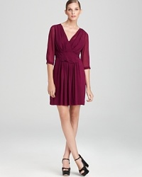 Sheer sleeves and delicate pleats infuse this DKNY dress with romantic inspiration, while a tie belt lends a flattering, feminine finish. Sheer sleeves and delicate pleats infuse this DKNY dress with romantic inspiration, while a tie belt lends a flattering, feminine finish.