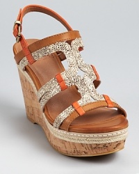 Snakeskin embossed leather mingles with smooth tangerine and dune hued leathers on these Lucky Brand wedges, finished with braided jute and a cork sole. Snakeskin embossed leather mingles with smooth tangerine and dune hued leathers on these Lucky Brand wedges, finished with braided jute and a cork sole.