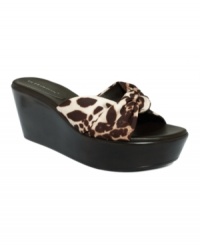 Rise up in BCBGeneration's Nikita slide sandals! With printed fabric uppers and 3 covered wedge heels, they'll take your look to the top. Rise up in BCBGeneration's Nikita slide sandals! With printed fabric uppers and 3 covered wedge heels, they'll take your look to the top.
