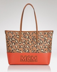 Give your look an punch of print with this tote from MCM. Made from coated canvas and splashed with spots, it boasts a look that's ready for work or play. Give your look an punch of print with this tote from MCM. Made from coated canvas and splashed with spots, it boasts a look that's ready for work or play.