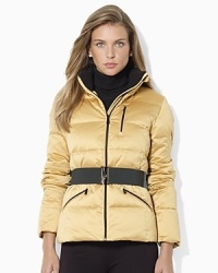 A modernized classic, the mockneck down jacket is given a chic belt for a slimming and stylish look. A modernized classic, the mockneck down jacket is given a chic belt for a slimming and stylish look.