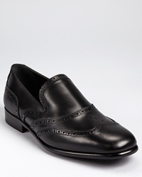 From Salvatore, an elegant loafer crafted from fine Italian leather accented with classic wingtip perforations. From Salvatore, an elegant loafer crafted from fine Italian leather accented with classic wingtip perforations.