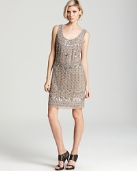 Aidan Mattox's intricately beaded dress channels vintage glamour when paired with antique-inspired jewels. Aidan Mattox's intricately beaded dress channels vintage glamour when paired with antique-inspired jewels.
