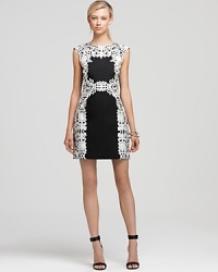 Flaunting a baroque-style lace print, this silk Tibi dress ensures statement chic. Team with simple heels for modern elegance. Flaunting a baroque-style lace print, this silk Tibi dress ensures statement chic. Team with simple heels for modern elegance.