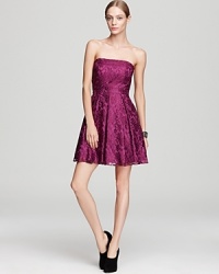 In jewel-tone metallic lace, this strapless Aqua dress lends a girlish look to festive affairs. In jewel-tone metallic lace, this strapless Aqua dress lends a girlish look to festive affairs.