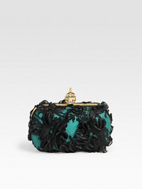 An elegant and feminine style in silk ribbons and lace over silk satin with an edgy skull accented closure.Top clasp closureLeather lining6¼W X 3½H X 1¼DMade in Italy An elegant and feminine style in silk ribbons and lace over silk satin with an edgy skull accented closure.Top clasp closureLeather lining6¼W X 3½H X 1¼DMade in Italy