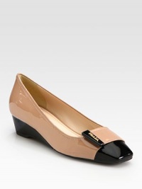 Bi-color patent leather cap toe style with demi-wedge and logo detail. Self-covered wedge, 1½ (40mm)Patent leather upperLeather liningRubber solePadded insoleImported Bi-color patent leather cap toe style with demi-wedge and logo detail. Self-covered wedge, 1½ (40mm)Patent leather upperLeather liningRubber solePadded insoleImported