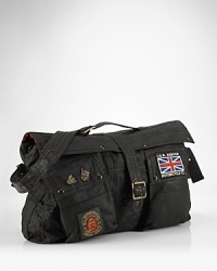 The iconic vintage motorcycle jacket is stylishly reincarnated as a sporty, patch-clad messenger bag, constructed with treated oilcloth for a waterproof finish. The iconic vintage motorcycle jacket is stylishly reincarnated as a sporty, patch-clad messenger bag, constructed with treated oilcloth for a waterproof finish.