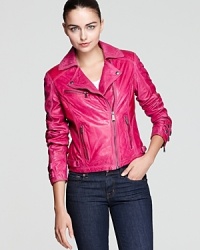 Motocross meets new wave with KORS Michael Kors' edgy-chic asymmetric leather jacket in blazing majenta and embellished with perforated accents and metal hardware. Motocross meets new wave with KORS Michael Kors' edgy-chic asymmetric leather jacket in blazing majenta and embellished with perforated accents and metal hardware.