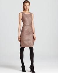 Exude sophisticated modernity in this supple Armani Collezioni leather dress, detailed with seaming and cut in a curve-hugging silhouette. Dark opaque tights create a cool contrast to the neutral-hued style. Exude sophisticated modernity in this supple Armani Collezioni leather dress, detailed with seaming and cut in a curve-hugging silhouette. Dark opaque tights create a cool contrast to the neutral-hued style.