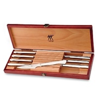 Eight stainless steel steak knives in a beautiful wood gift box by J.A. Henckels, a name synonymous for unsurpassed quality and craftsmanship. Eight stainless steel steak knives in a beautiful wood gift box by J.A. Henckels, a name synonymous for unsurpassed quality and craftsmanship.
