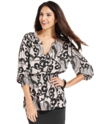 With a graphic scroll print and a stylish peplum hem, this Alfani top adds a pop of pattern to your look! With a graphic scroll print and a stylish peplum hem, this Alfani top adds a pop of pattern to your look!