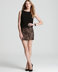 Adrianna Papell dresses up the little black dress with lace details, brought to life on a blouson silhouette. Adrianna Papell dresses up the little black dress with lace details, brought to life on a blouson silhouette.