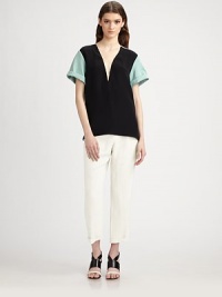 Silky washed satin, in a cropped silhouette finished with crisp front pleats and a contrasting waistband.Contrast waistbandZip flyFront pleatsSide slash pocketsBack welt pocketsSilk liningInseam, about 2399% rayon/1% silkDry cleanMade in ItalyModel shown is 5'9 (175cm) wearing US size 4. Silky washed satin, in a cropped silhouette finished with crisp front pleats and a contrasting waistband.Contrast waistbandZip flyFront pleatsSide slash pocketsBack welt pocketsSilk liningInseam, about 2399% rayon/1% silkDry cleanMade in ItalyModel shown is 5'9 (175cm) wearing US size 4.