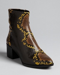 B Brian Atwood amps up this season's have-to-have-them booties with stand-out snake embossed uppers. Pointed toes and abbreviated heels give them Western kick. B Brian Atwood amps up this season's have-to-have-them booties with stand-out snake embossed uppers. Pointed toes and abbreviated heels give them Western kick.