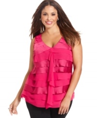 A ruffled front lends romantic appeal to Alfani's sleeveless plus size top-- dress it up with trousers or down with denim. A ruffled front lends romantic appeal to Alfani's sleeveless plus size top-- dress it up with trousers or down with denim.