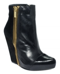 An exposed zipper lines the side of RACHEL Rachel Roy's Camino platforms, making this eye-catching pair of wedge booties one you'll love to show off. An exposed zipper lines the side of RACHEL Rachel Roy's Camino platforms, making this eye-catching pair of wedge booties one you'll love to show off.