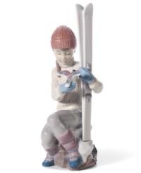 This little girl is taking a break from a day at the slopes as she sits with her skis and a small bird perched upon her hand. Handcrafted from Lladro. This little girl is taking a break from a day at the slopes as she sits with her skis and a small bird perched upon her hand. Handcrafted from Lladro.