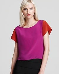 This color block Gryphon tee proves casual can still be chic. In ravishing pink and red, the silk piece adds instant flair to everything from staple LBPs to distressed denim. This color block Gryphon tee proves casual can still be chic. In ravishing pink and red, the silk piece adds instant flair to everything from staple LBPs to distressed denim.