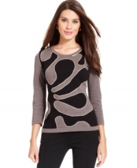 Alfani's sweater looks especially sleek with a graphic intarsia at the front and a flattering fit. Alfani's sweater looks especially sleek with a graphic intarsia at the front and a flattering fit.