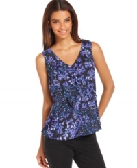This petite top from DKNY Jeans feature a mixture of pretty florals and ruffles, creating an ultra-feminine look. This petite top from DKNY Jeans feature a mixture of pretty florals and ruffles, creating an ultra-feminine look.