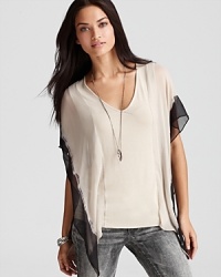 Bohemian inspired in floaty chiffon, this ethereal-looking Bailey 44 top offers a blouse-meets-poncho silhouette withchic, dip-dyed color accents. Bohemian inspired in floaty chiffon, this ethereal-looking Bailey 44 top offers a blouse-meets-poncho silhouette withchic, dip-dyed color accents.