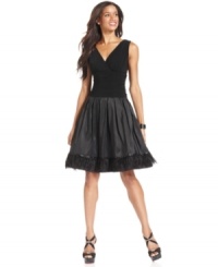 A hemline full of feathery fringe makes this petite SL Fashions party dress extra fun. A hemline full of feathery fringe makes this petite SL Fashions party dress extra fun.