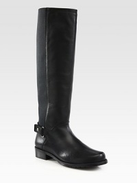 A minimalist design combining fine leather with micro-stretch panels for the ultimate in superior comfort. Stacked heel, 1¼ (30mm)Shaft, 16Leg circumference, 13½Leather upper with micro-stretch fabric panelsPull-on style and leather strap with snap closureLeather liningRubber solePadded insoleMade in Spain