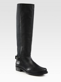 A minimalist design combining fine leather with micro-stretch panels for the ultimate in superior comfort. Stacked heel, 1¼ (30mm)Shaft, 16Leg circumference, 13½Leather upper with micro-stretch fabric panelsPull-on style and leather strap with snap closureLeather liningRubber solePadded insoleMade in Spain A minimalist design combining fine leather with micro-stretch panels for the ultimate in superior comfort. Stacked heel, 1¼ (30mm)Shaft, 16Leg circumference, 13½Leather upper with micro-stretch fabric panelsPull-on style and leather strap with snap closureLeather liningRubber solePadded insoleMade in Spain
