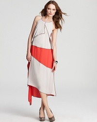 This BCBGMAXAZRIA color-block dress boasts a flowing silhouette, creating graceful movement on and off the dance floor.