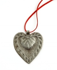 Show heart. Hand-cut and hammered in recycled steel, the Floral Heart pendant is full of unique textured detail and made with love by artisans determined to rebuild their lives. After two coats of varnish, each is dried in the hot Caribbean sun. A beautiful gift. Show heart. Hand-cut and hammered in recycled steel, the Floral Heart pendant is full of unique textured detail and made with love by artisans determined to rebuild their lives. After two coats of varnish, each is dried in the hot Caribbean sun. A beautiful gift.