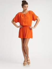 An easy blouson shift of sumptuous silk georgette, softly gathered from shoulder-to-hem with a shapely shirred waist.BoatneckTie-front keyholeGathered dropped shouldersFlutter sleevesBlouson bodiceElastic waistbandGathered skirtAbout 14 from natural waistSilkDry cleanImportedModel shown is 5'10 (177cm) wearing US size Small. An easy blouson shift of sumptuous silk georgette, softly gathered from shoulder-to-hem with a shapely shirred waist.BoatneckTie-front keyholeGathered dropped shouldersFlutter sleevesBlouson bodiceElastic waistbandGathered skirtAbout 14 from natural waistSilkDry cleanImportedModel shown is 5'10 (177cm) wearing US size Small.