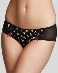 An edgy bikini with sheer mesh panels at hips and tattoo print all over. An edgy bikini with sheer mesh panels at hips and tattoo print all over.