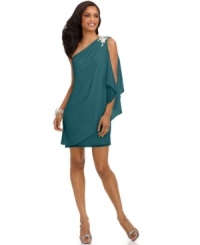 Channeling goddess-inspired glamour, this airy one-shoulder draped dress from JS Boutique makes a striking impression. Channeling goddess-inspired glamour, this airy one-shoulder draped dress from JS Boutique makes a striking impression.