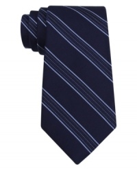 Stripes make a statement on this handsome DKNY silk tie. Stripes make a statement on this handsome DKNY silk tie.