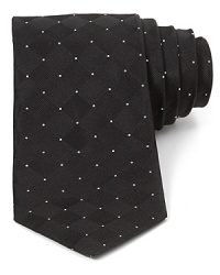 The subtle tonal weave pattern of this skinny silk tie is balanced by allover dots for an exceptionally cool dimensional effect. The subtle tonal weave pattern of this skinny silk tie is balanced by allover dots for an exceptionally cool dimensional effect.