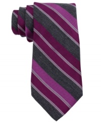 Be bold-start the day with confidence in this striped silk tie from Calvin Klein.