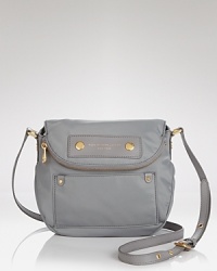 Sleek, streamlined nylon fashions a sporty-prep crossbody with cool girl credentials. Logo detailing and hardware elevate the MARC BY MARC JACOBS look. Sleek, streamlined nylon fashions a sporty-prep crossbody with cool girl credentials. Logo detailing and hardware elevate the MARC BY MARC JACOBS look.