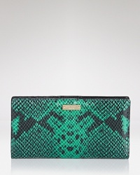 This kate spade new york wallet flaunts a perfect mix of style and substance, crafted of snake embossed leather. It's a wildly exotic essential.