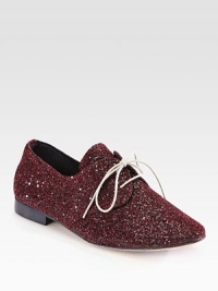 Youthful silhouette of glitter-coated canvas topped with laces for on-the-go style. Glitter-coated canvas upperCanvas liningLeather solePadded insoleMade in Italy Youthful silhouette of glitter-coated canvas topped with laces for on-the-go style. Glitter-coated canvas upperCanvas liningLeather solePadded insoleMade in Italy