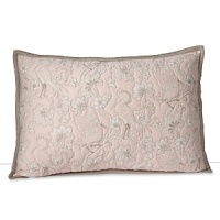 A delicately stitched sham, printed with floral branches and birds in muted hues of tan and pink. A delicately stitched sham, printed with floral branches and birds in muted hues of tan and pink.