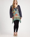Sumptuous silk and a phenomenal floral print create a spectacular tunic. This relaxed-fit top pairs nicely with solid-hued leggings or pants.V-neckLong sleevesFloral print on front centerContrast hem and back yokeAbout 35 from shoulder to hemSilkHand washImported