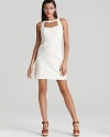 A skin-revealing cutout at the neckline lends bold interest to this Nanette Lepore lace dress.