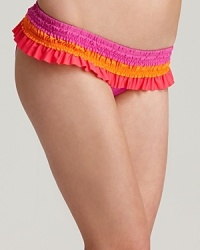 Smocked ruffles take on the color block trend on Becca's Sunrise Ruffle bikini bottom, a vibrant option for standing out on the seashore. Smocked ruffles take on the color block trend on Becca's Sunrise Ruffle bikini bottom, a vibrant option for standing out on the seashore.