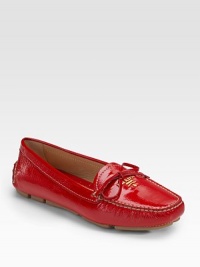 Patent leather with bow and golden logo hardware.Rounded toe Leather lining Padded insole Rubber sole Made in ItalyOUR FIT MODEL RECOMMENDS ordering true size. Patent leather with bow and golden logo hardware.Rounded toe Leather lining Padded insole Rubber sole Made in ItalyOUR FIT MODEL RECOMMENDS ordering true size.